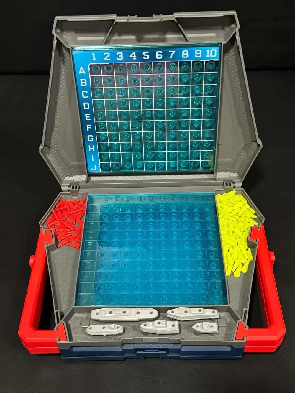 Hasbro Battleship Portable Strategy Board Game with Red and Yellow Pegs